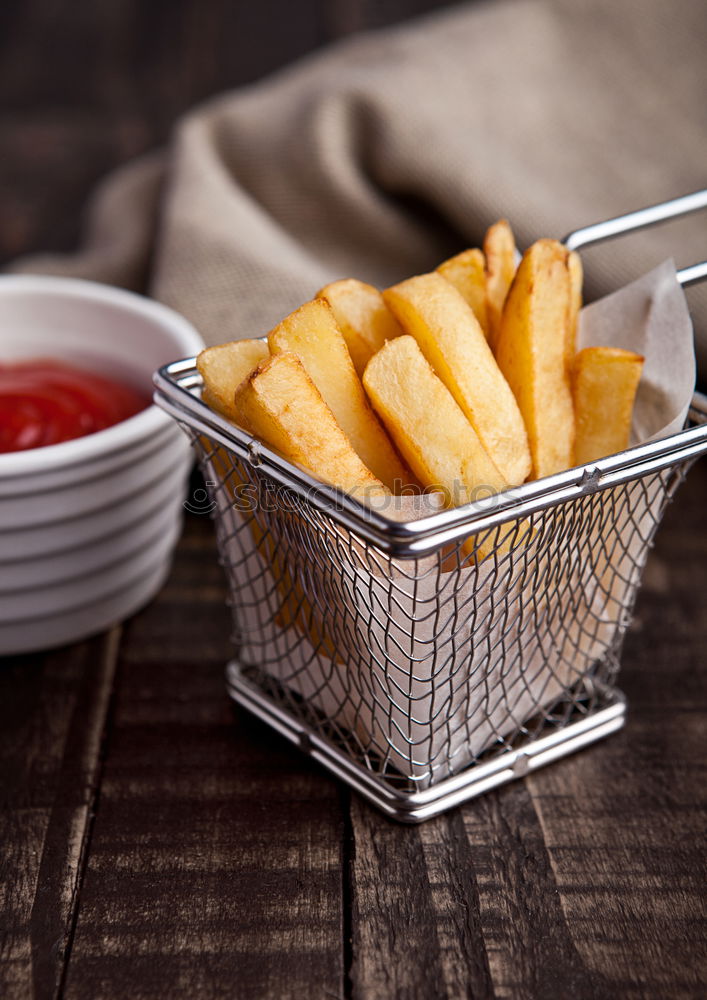 Similar – Salchipapas (Fries with Sausage) South American Fast Food