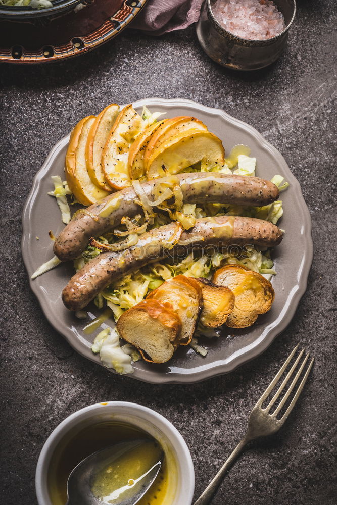 Similar – Bratwurst with potatoes and sauerkraut