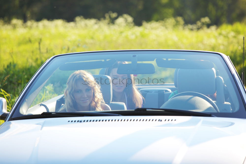 Similar – Black woman driving a vintage convertible car