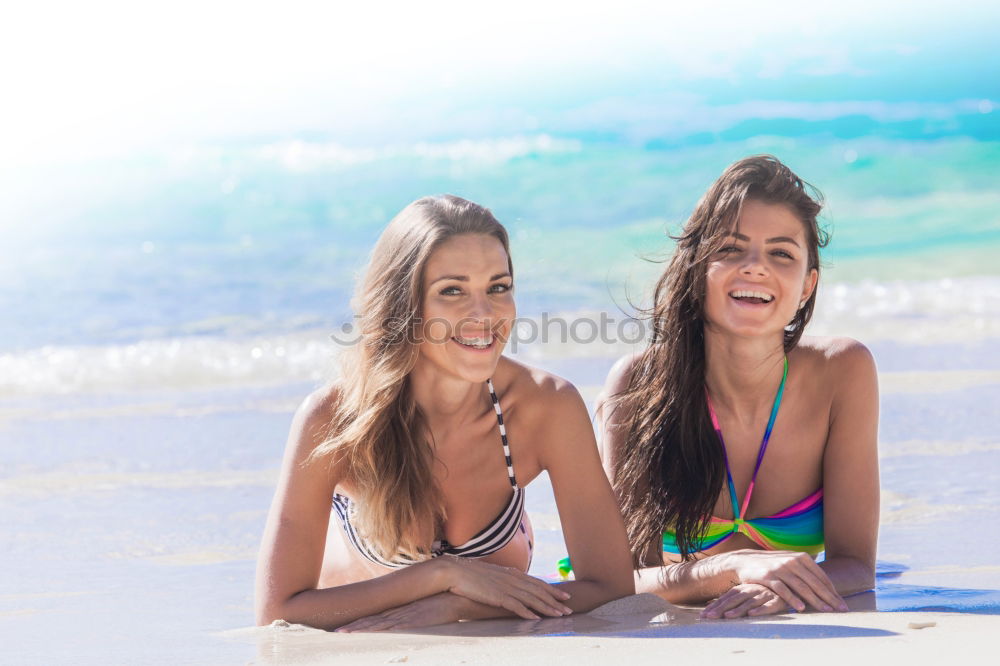 Similar – Two young women in swimsuit on a tropical beach