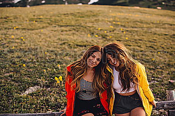 Similar – Image, Stock Photo Stylish women browsing phone on breathtaking landscape