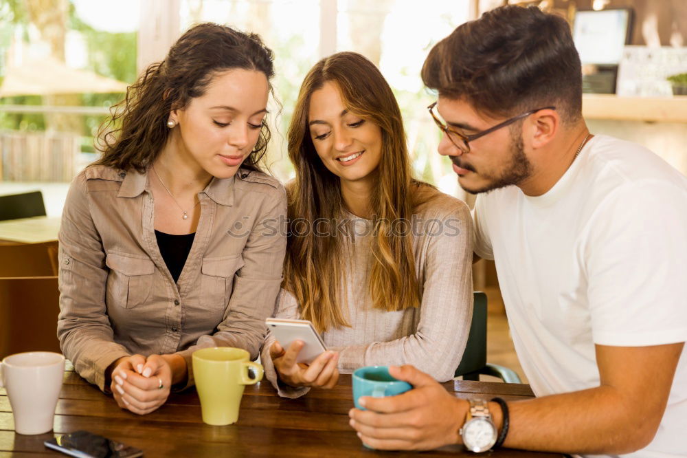 Similar – Happy family at home in the couch playing classic table games