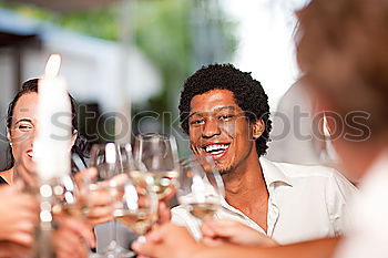 Similar – Cute mixed race couple enjoying wine together on date