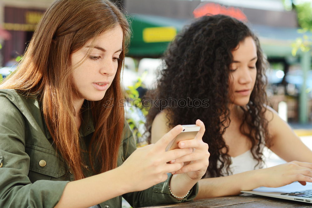 Similar – Image, Stock Photo Two male teenagers surfing the internet on tablet computer while sitting in cafe. One young man pointing at screen