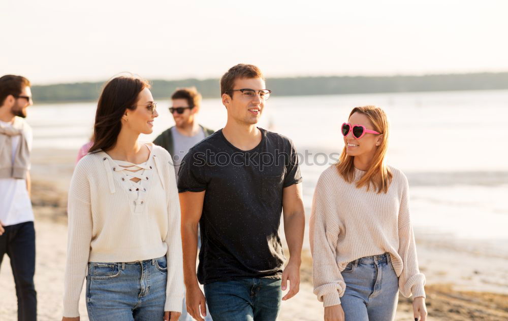 Similar – Family spending vacation time together having a snack sitting on jetty over the lake on sunny day in the summertime