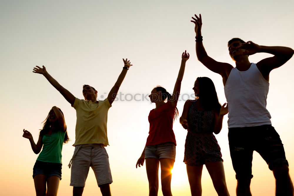 Similar – Multi ethnic group of friends dancing on music festival