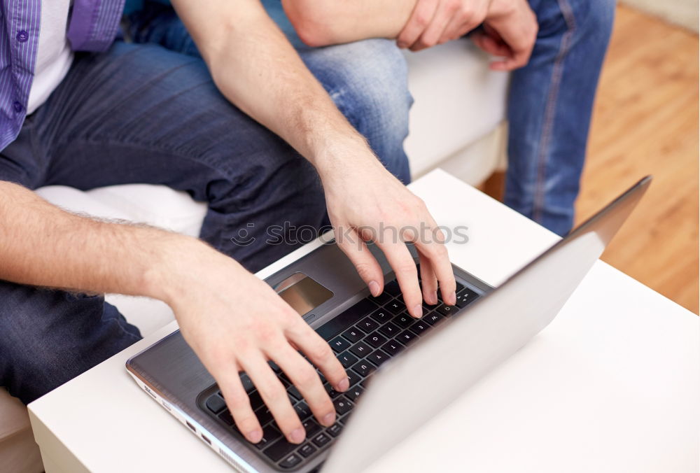 Similar – Two businessman meeting and using smartphone with laptop at outdoor cafe