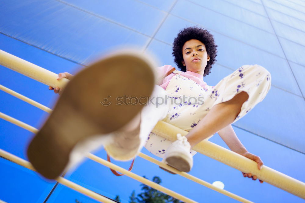 Similar – Woman with afro hair climbing by children’s attractions.