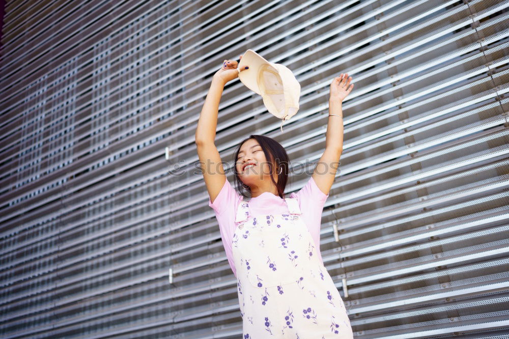 Similar – beautiful mixed girl listening to the music happy in the street