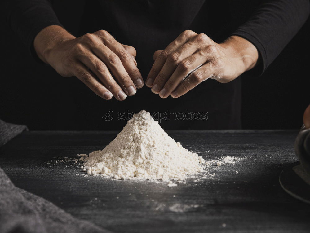 Similar – Image, Stock Photo white wheat flour in male hands, black background