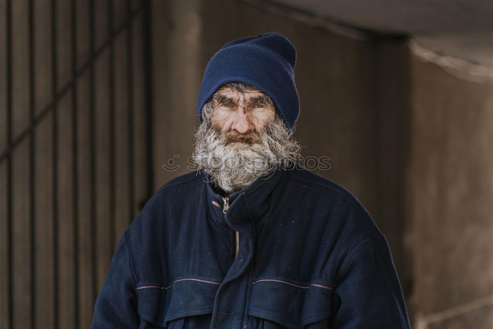 Similar – Happy man with a mustache in a knitted winter cap and warm winter clothing