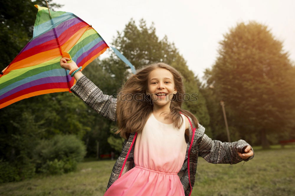 Similar – Image, Stock Photo Woman holding the Gay Rainbow Flag on green meadow outdoor