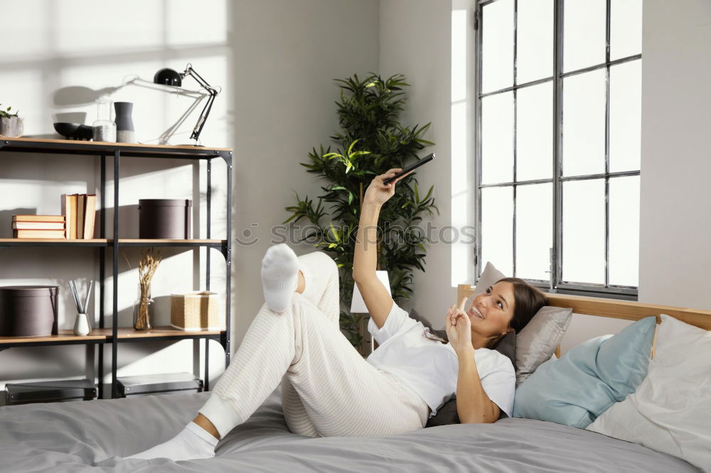 Similar – Image, Stock Photo Smiling woman lying on table