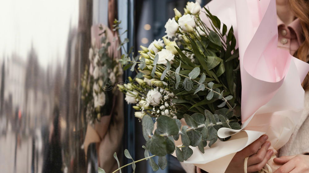 Similar – Image, Stock Photo Woman wrapping Christmas wreath with natural flowers