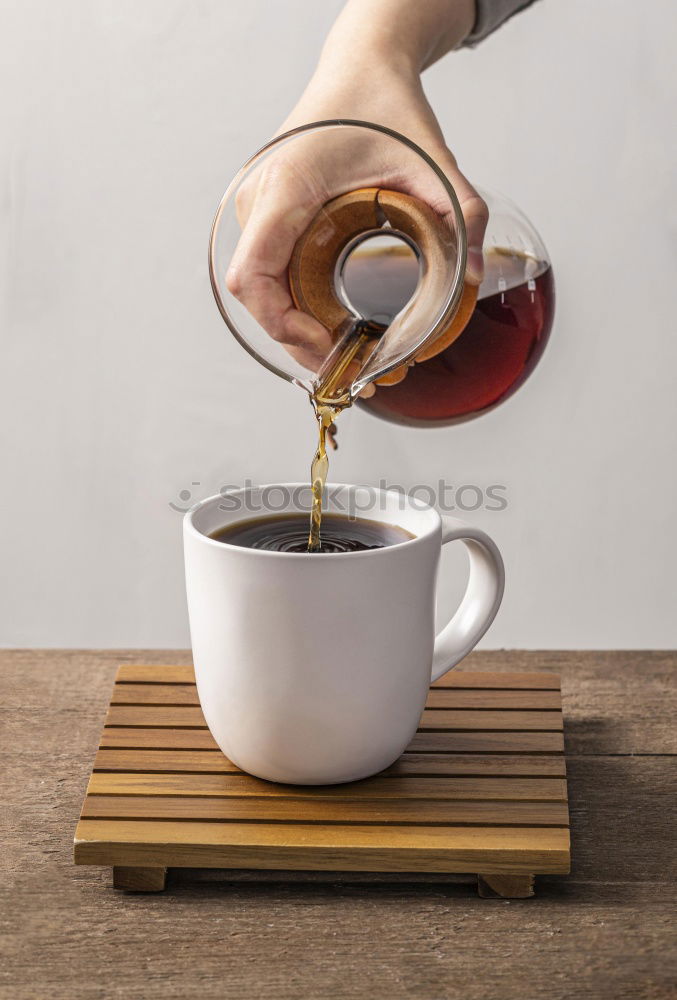 Similar – Image, Stock Photo Hand drip coffee, pouring water on coffee ground with filter drip style