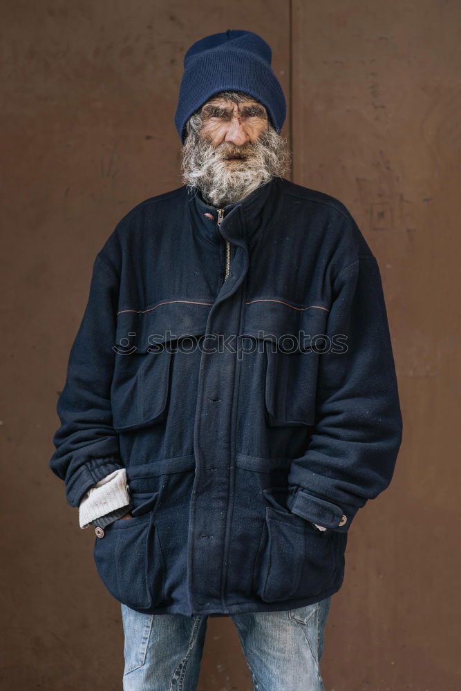 Similar – Happy man with a mustache in a knitted winter cap and warm winter clothing