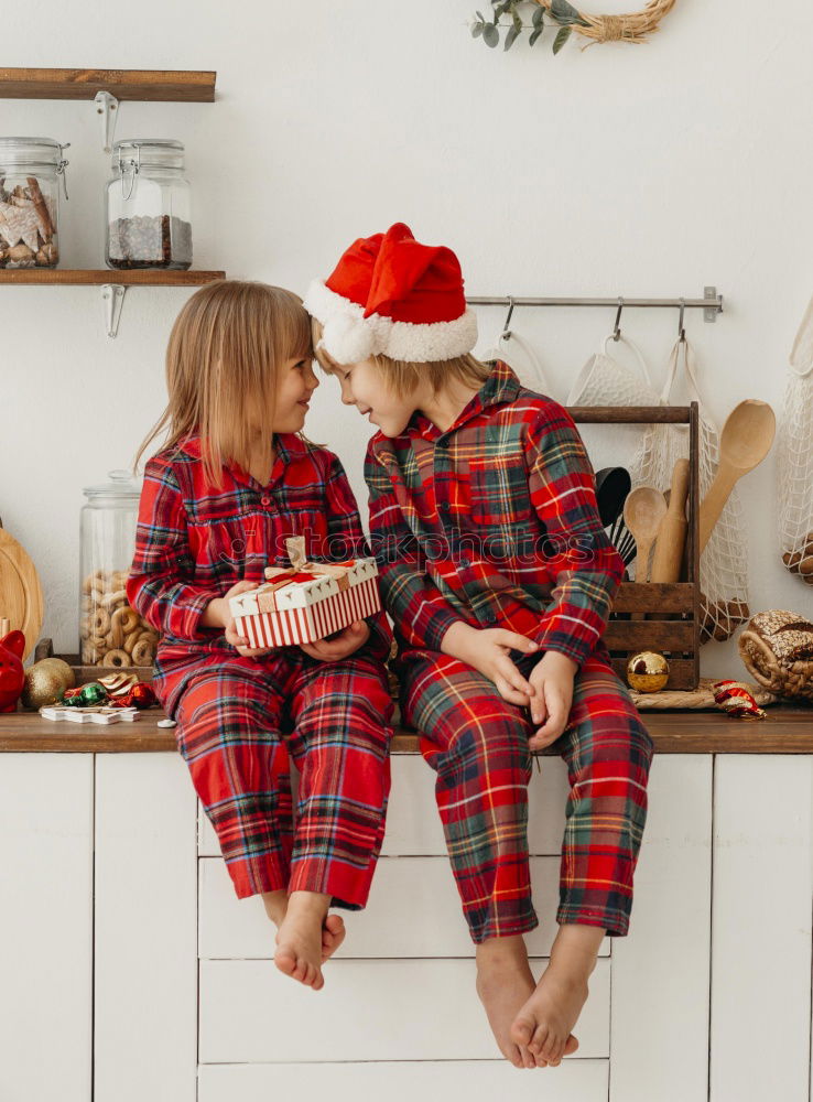 Similar – Image, Stock Photo Mother and son putting christmas costume on