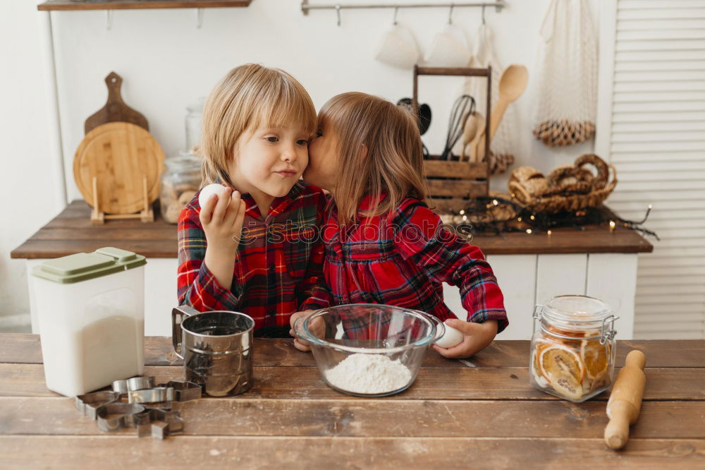 Little sisters girl preparing baking cookies.