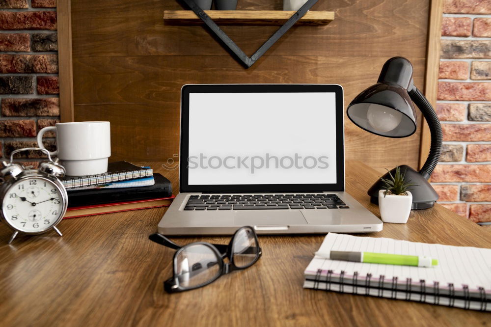 Similar – laptop, notepad, glasses and camera on the wooden desk