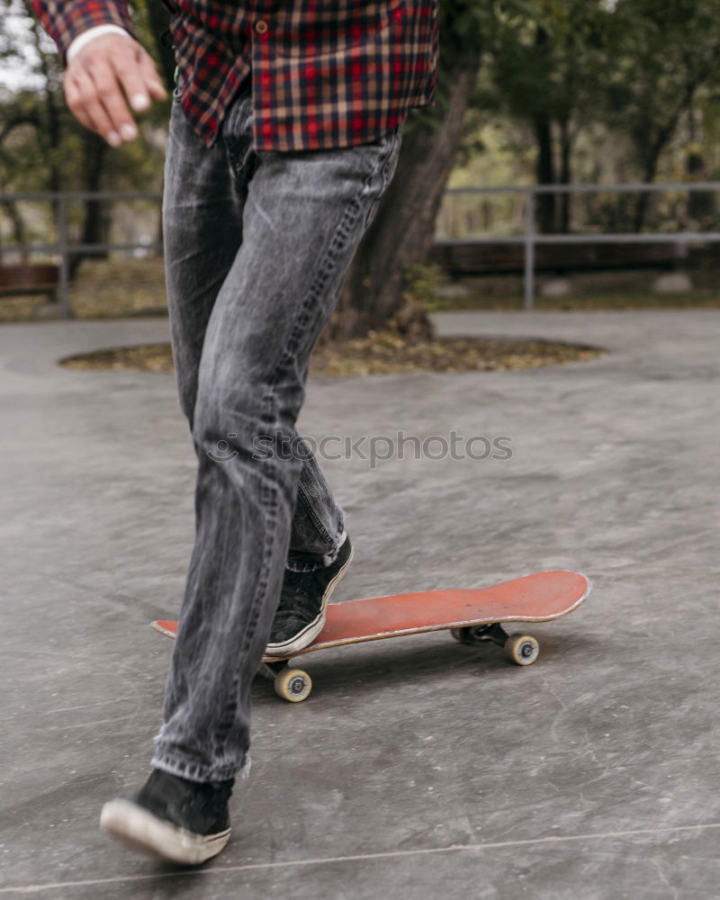 Similar – Man with tattoos holding skateboard at shore. Back view.