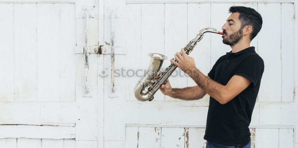 Similar – Image, Stock Photo Smiling jazzman with sax
