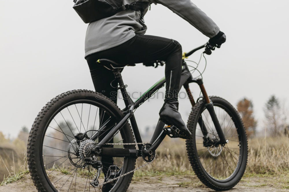 Similar – Cyclist Riding a bike at sunset. Sports