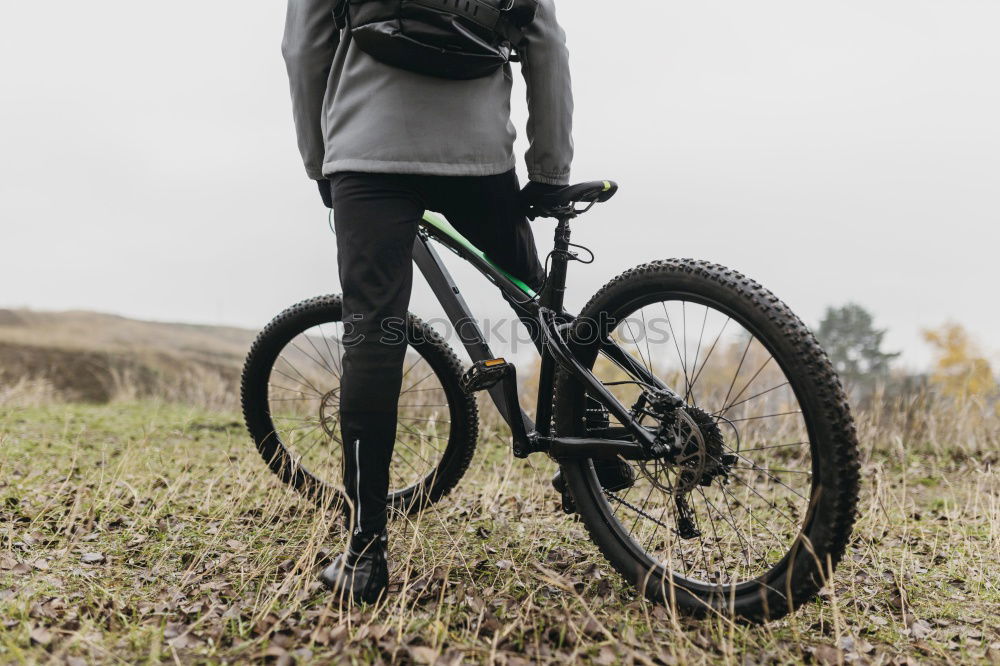 Similar – Cyclist Riding a bike at sunset. Sports