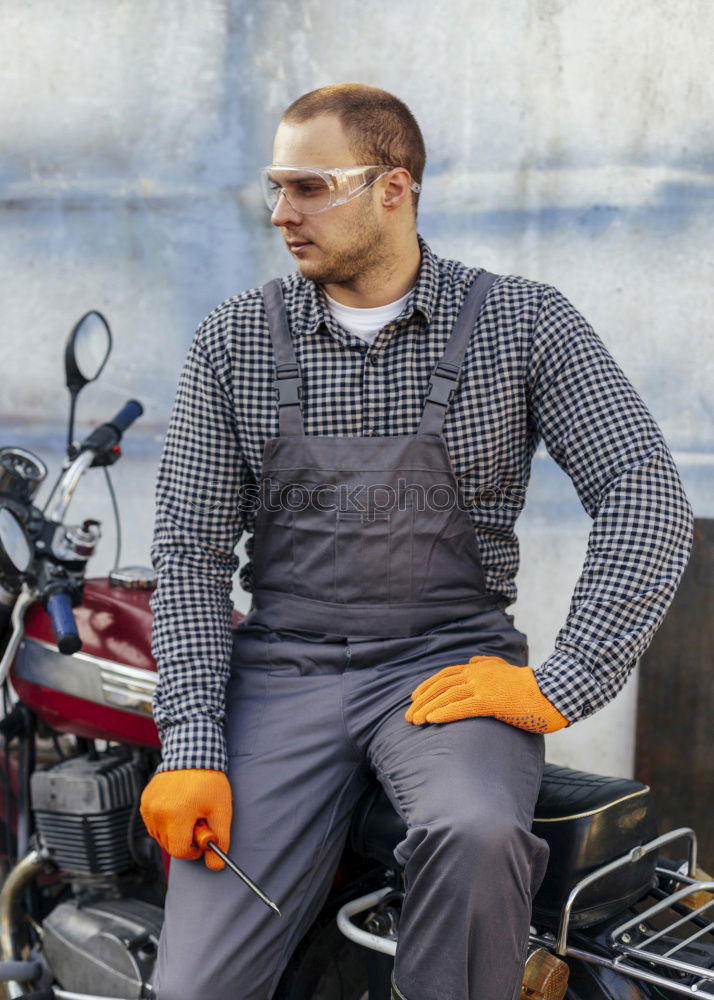 Man on bike at garage