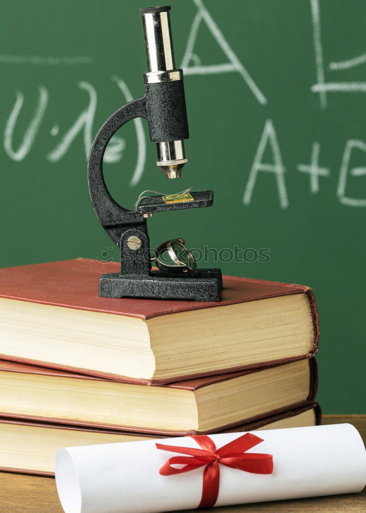 Similar – Image, Stock Photo books and microscope on the desk on green background