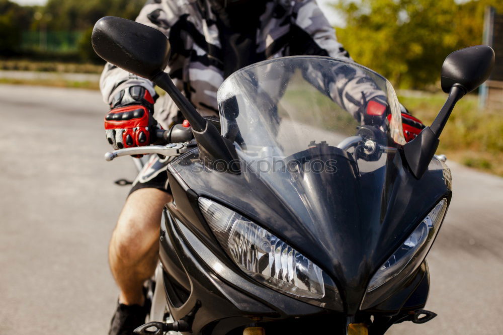 Similar – Man on bike looking away