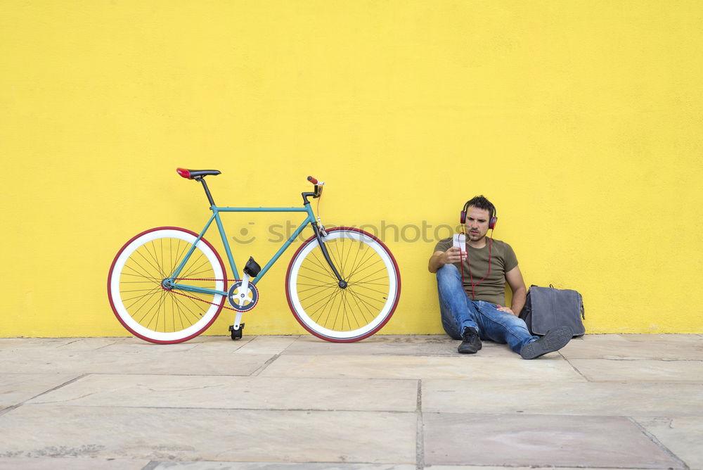 Similar – Side view of a young hipster man with a fixed bike