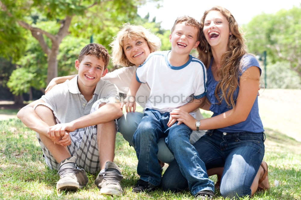 Similar – Happy family in a urban park playing with tablet computer