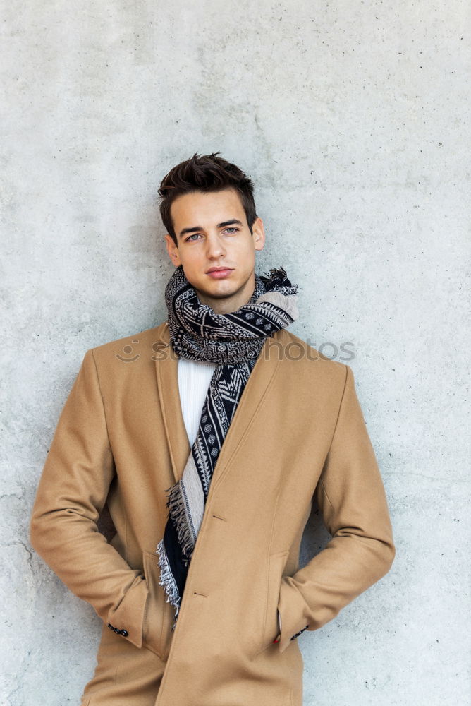 Similar – Image, Stock Photo Front view of trendy young man wearing coat and scarf