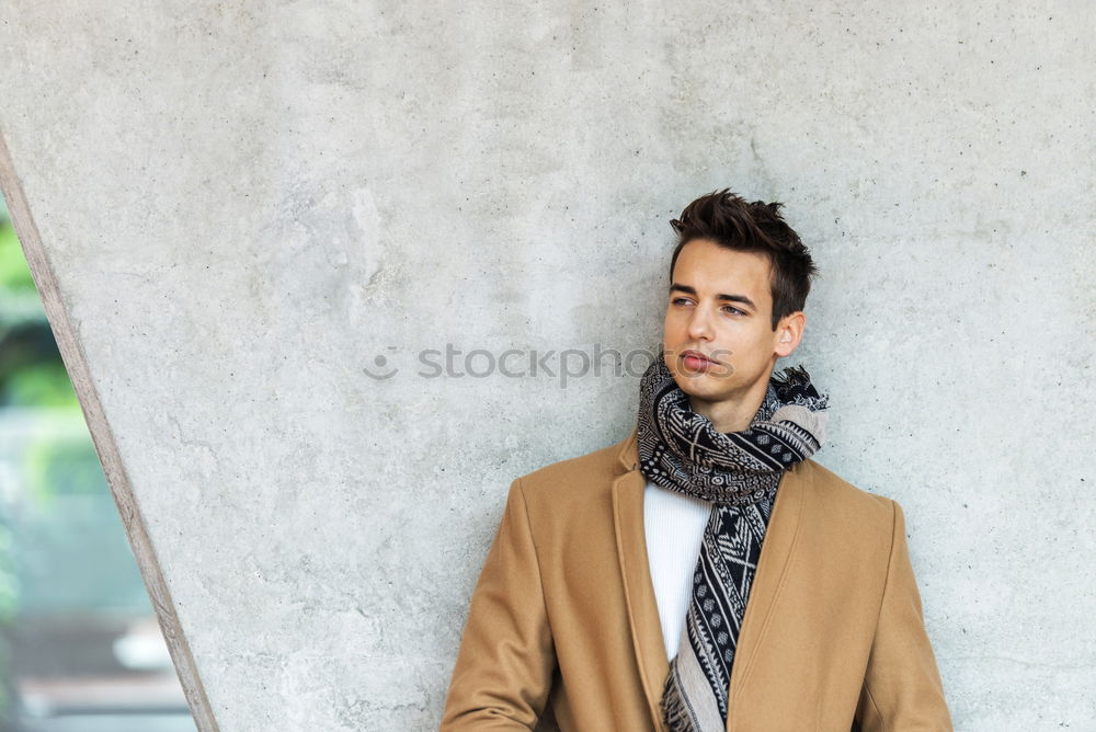 Image, Stock Photo Front view of trendy young man wearing coat and scarf