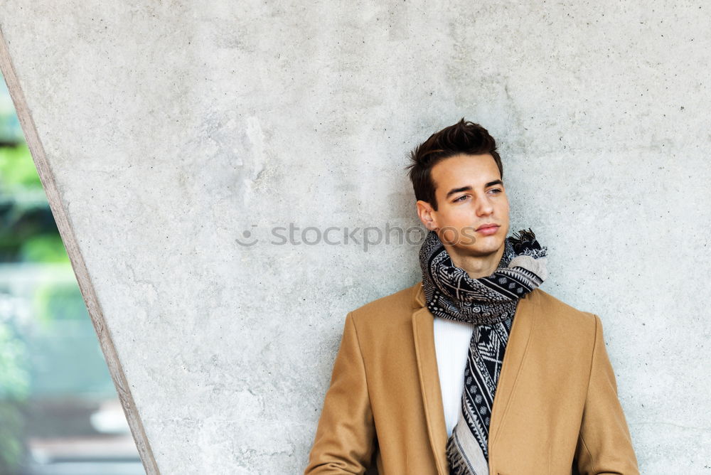 Similar – Image, Stock Photo Front view of trendy young man wearing coat and scarf