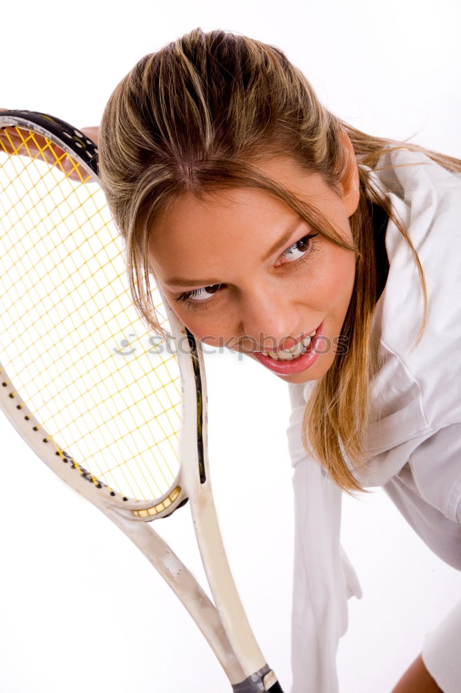 Face of a young woman hiding behind a featherball bat. Repeating the colour red. Sports grouch. Unsportsmanlike. Defense