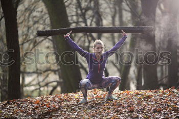 Similar – Woman stretching her body in front of ancient wall in park