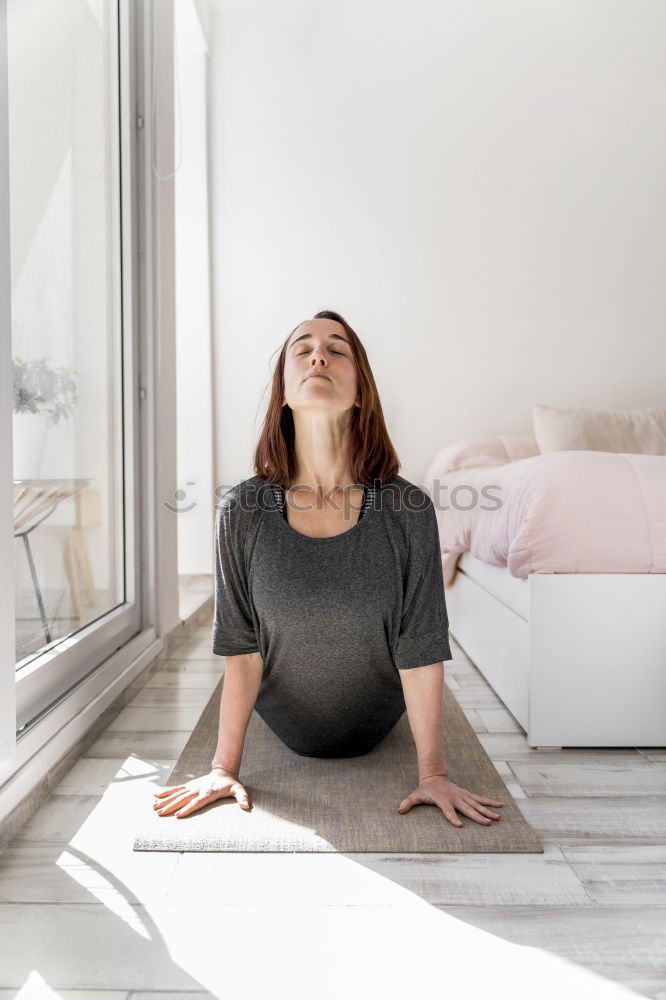 Similar – Woman stretching in bed