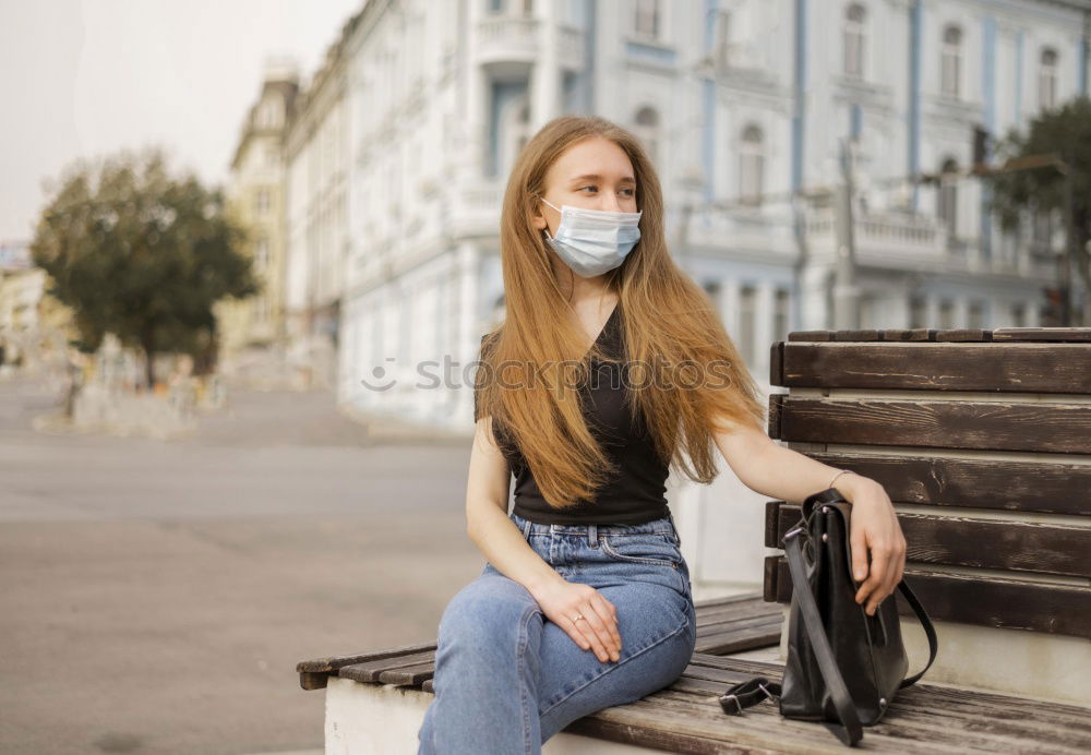 Similar – Young woman in medical mask standing near blooming flowers