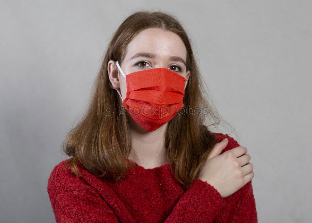 Similar – Image, Stock Photo Young pretty woman looks anxiously into the camera with wrinkled forehead and mask. Red Nose Day with funny, funny clown mask, with red bobble, pompom to protect against corona. Blonde, young, long-haired woman with cool face mask outside in the nature.