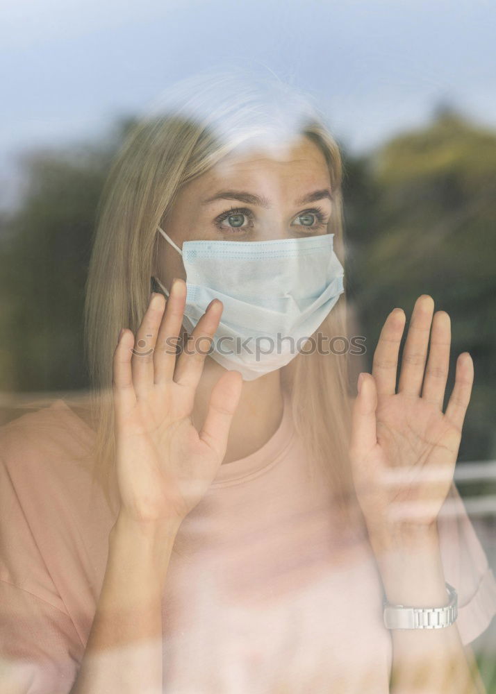 Similar – Young woman in medical mask standing near blooming flowers