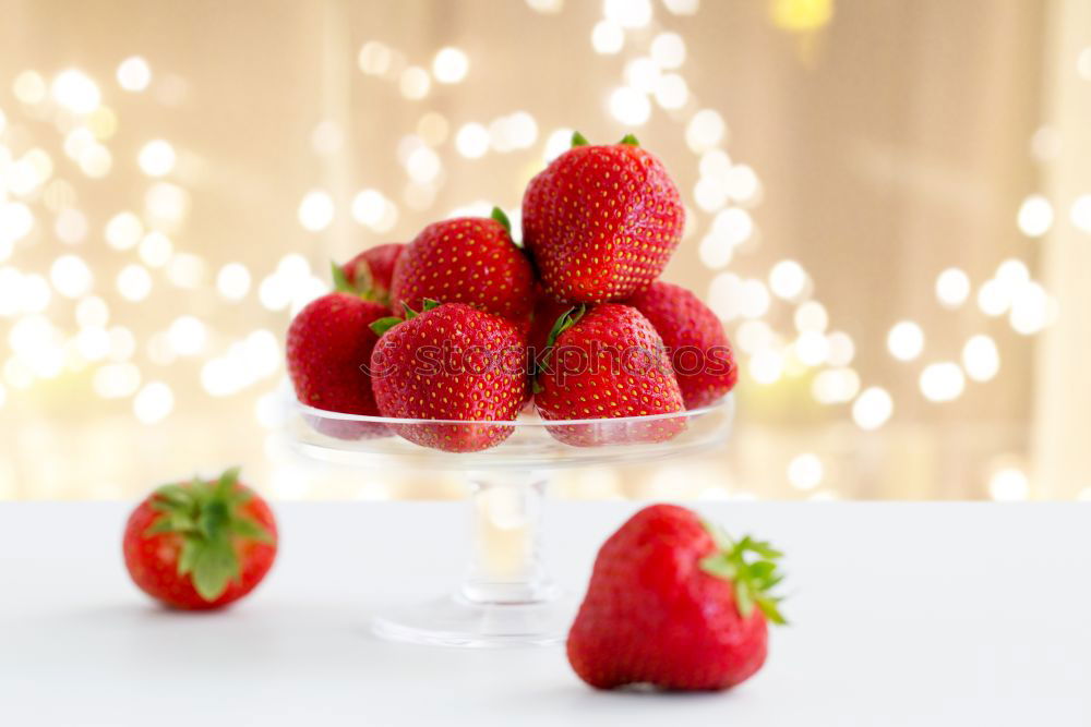 Similar – Pink sweet lemonade made of raspberry juice with frosted blackberries and strawberry blossom in a glass with sugar rim and drinking straw on striped tablecloth