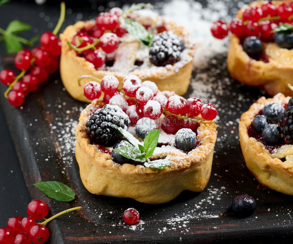 Similar – Delicious tartlets with raspberries and blueberries