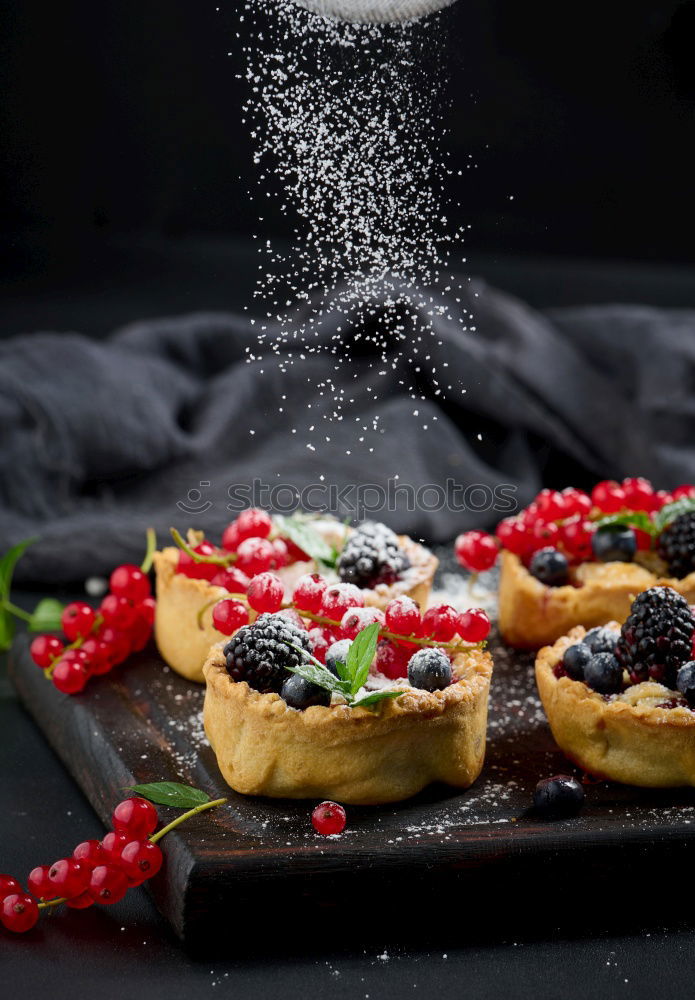 Similar – Delicious tartlets with raspberries and blueberries