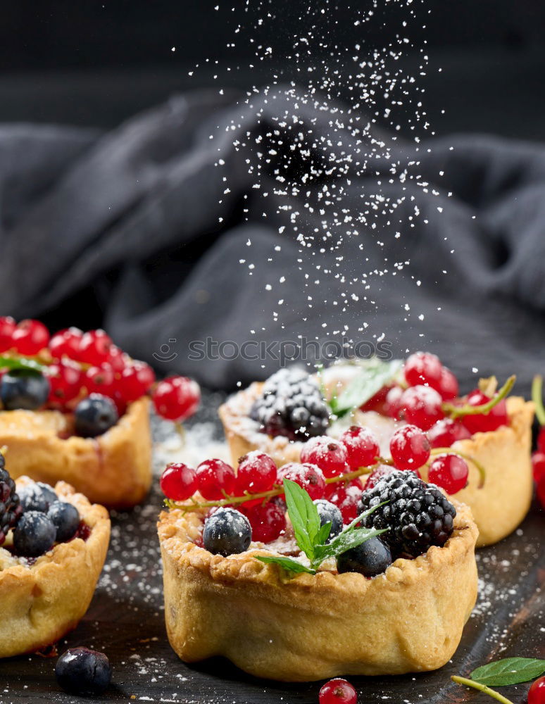 Delicious tartlets with raspberries and blueberries