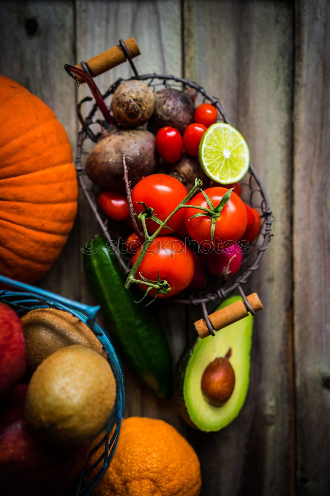 Similar – Image, Stock Photo Pumpkin and autumn vegetables on the kitchen table