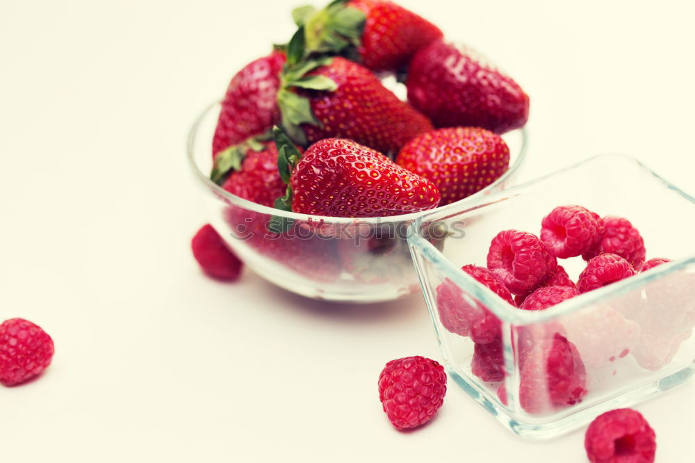 Similar – Pink sweet lemonade made of raspberry juice with frosted blackberries and strawberry blossom in a glass with sugar rim and drinking straw on striped tablecloth