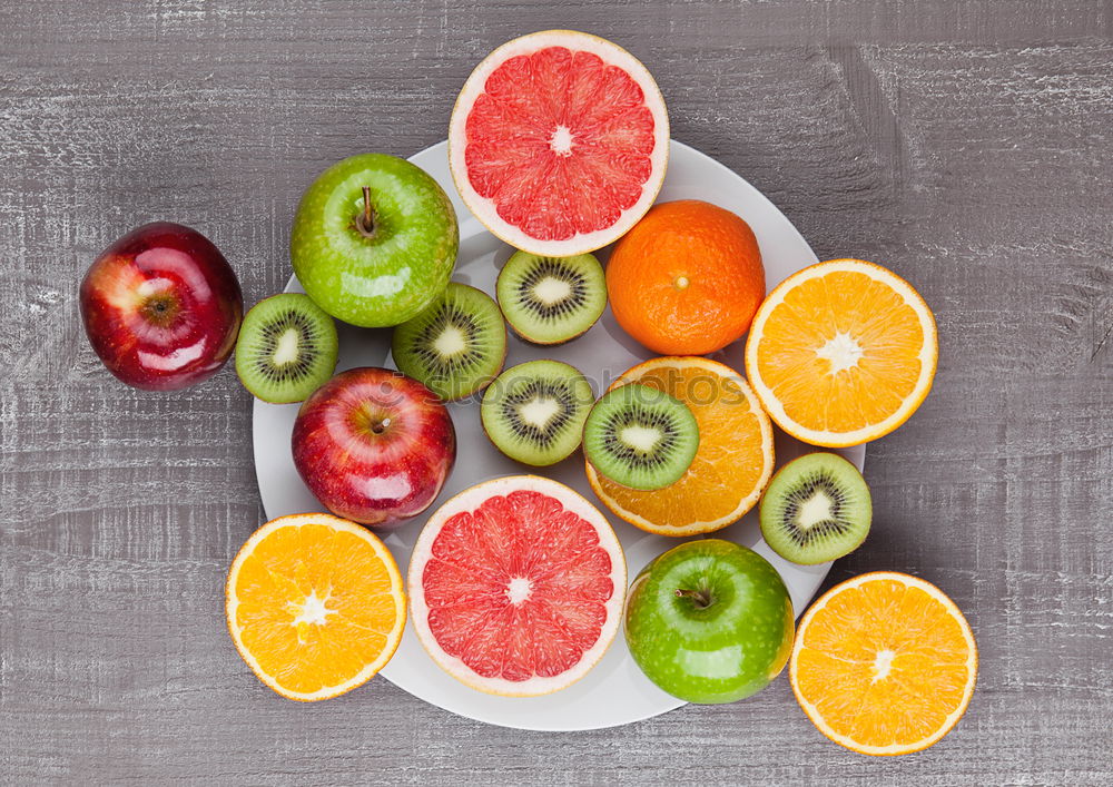 Similar – Image, Stock Photo Slices of citrus on round plate