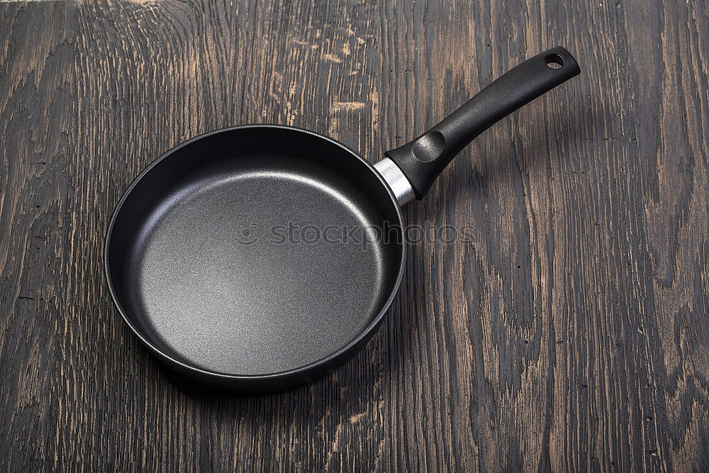 Similar – black round cast iron pan