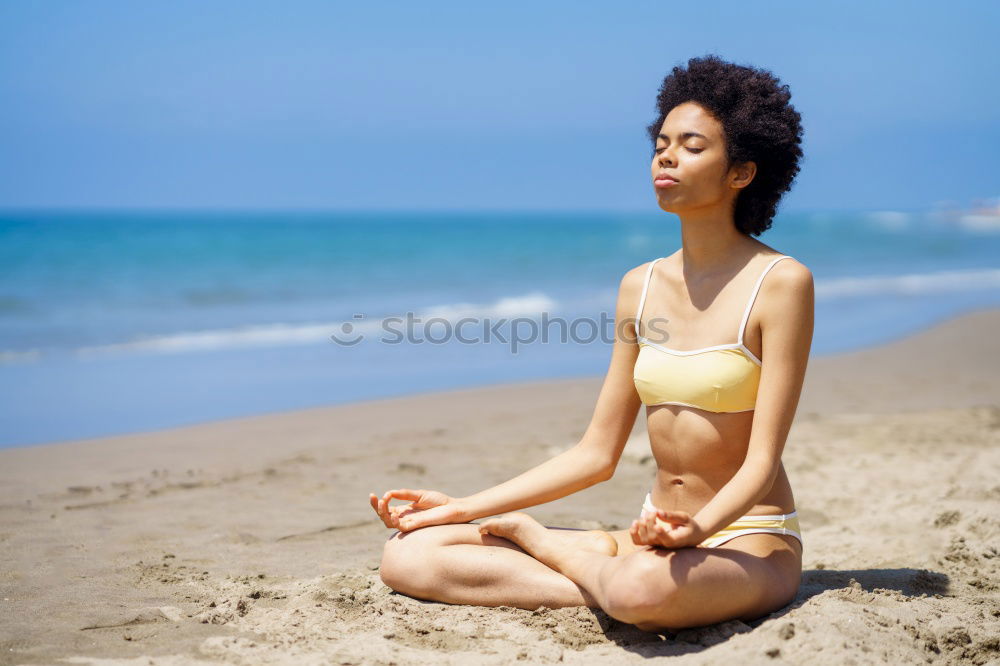 Image, Stock Photo Black woman, afro hairstyle, doing yoga in the beach